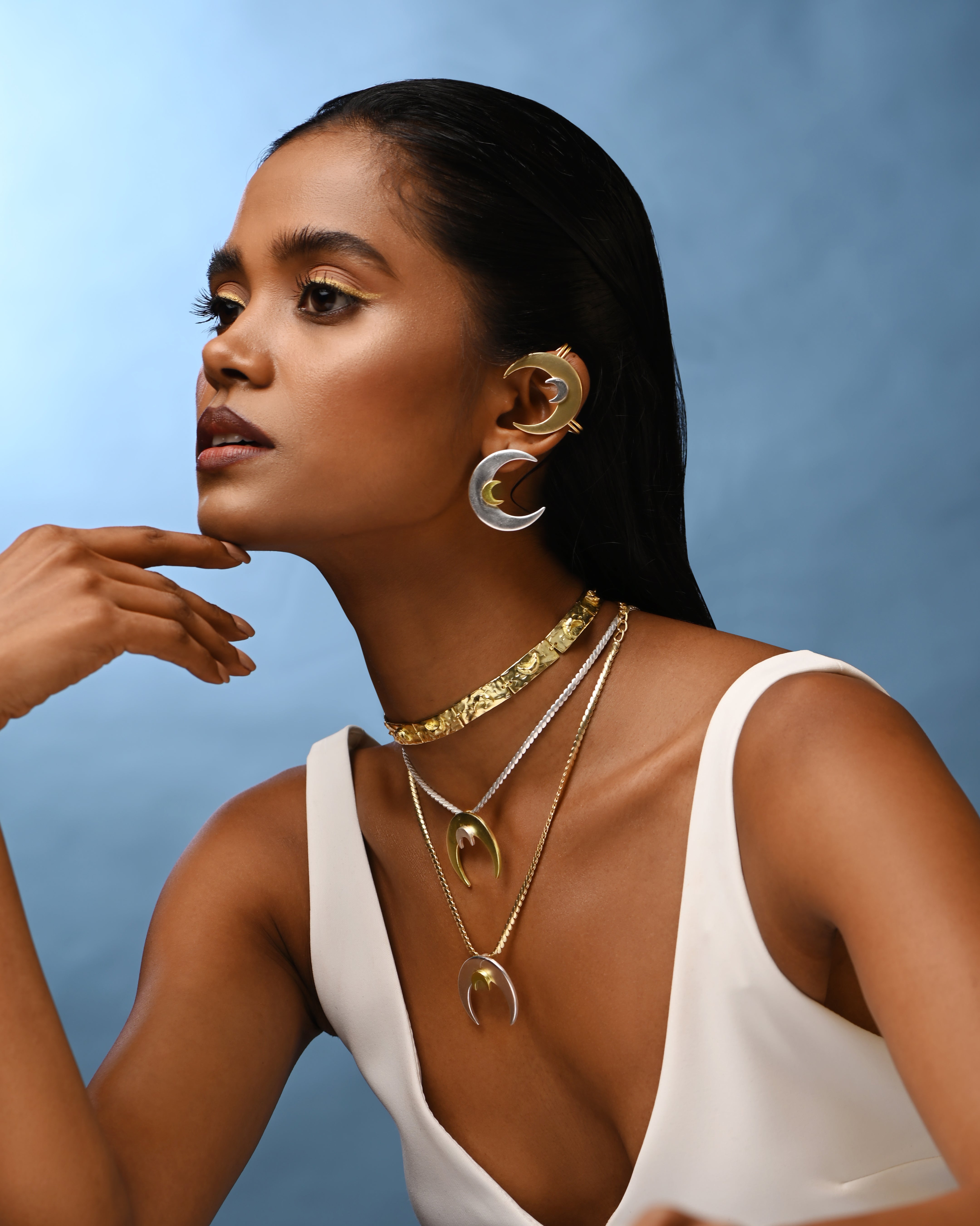 Woman styled in moon inspired mix metal jewellery