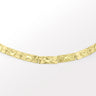 Crescent charm bracelet in gold with textured moon accents.