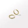 Gold hoop earrings on a white background