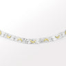 A handcrafted mix metal bracelet with a 3D moon crescent charm in silver with gold accents.