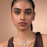 Woman wearing the silver Pilgrim necklace with a pendant