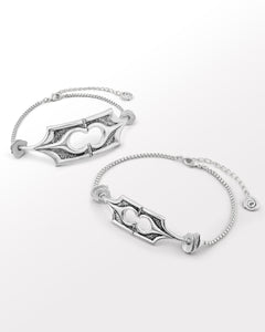 Two silver choker necklaces with intricate structural designs and oxidised finish