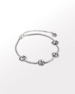 Silver choker with knot charms